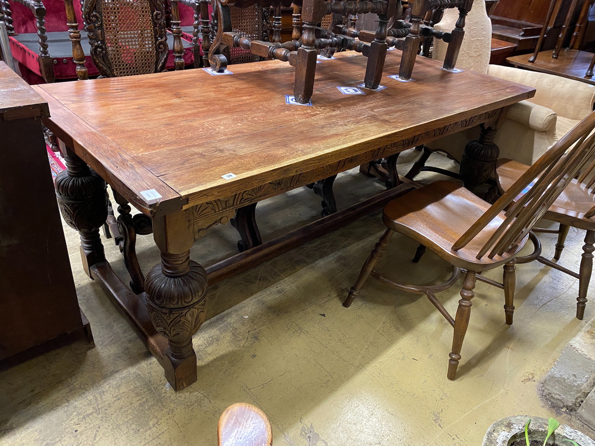 A 17th century style rectangular oak refectory table, width 194cm, depth 88cm, height 74cm